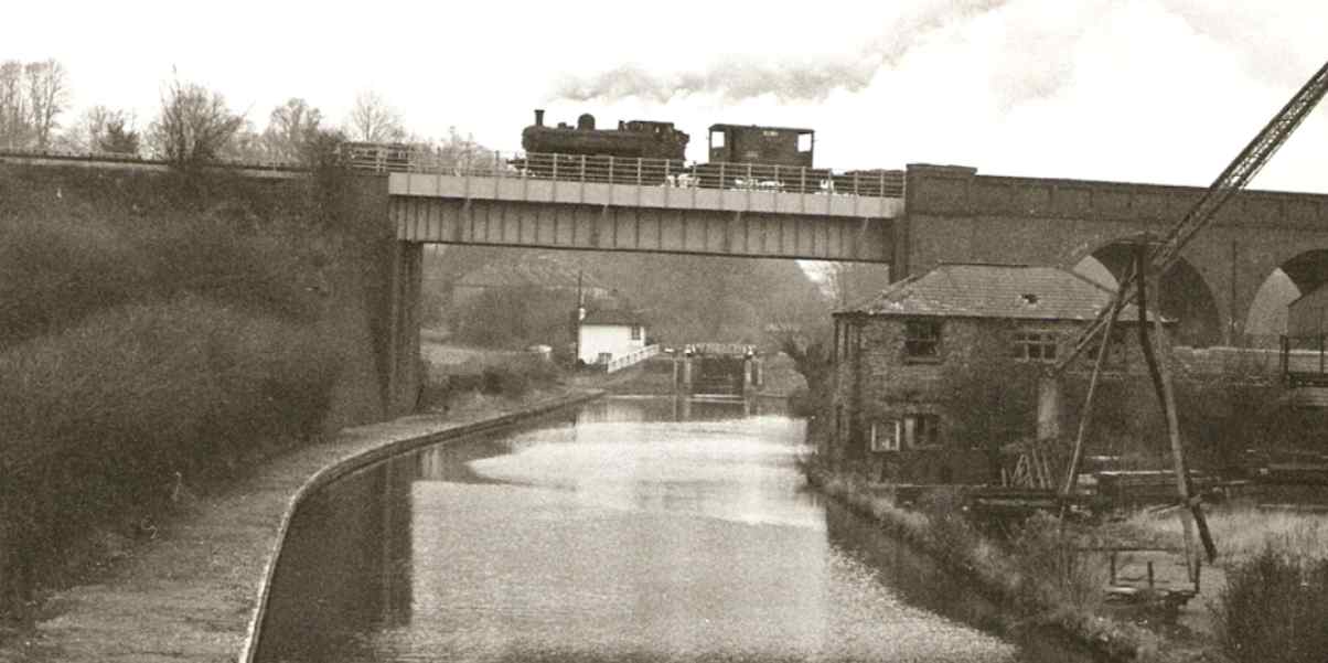 Steam train over Cassiobury bridge 1967